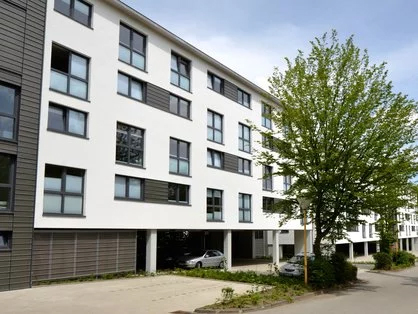 Exterior view of white building with several floors